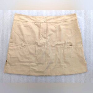 IZOD golf skirt with lined shorts cream size 14